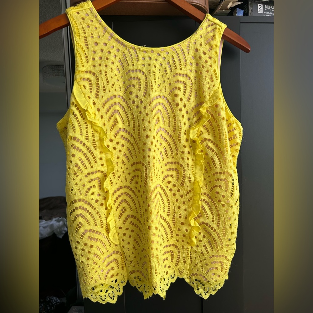Bright yellow top with a tie at the ba k